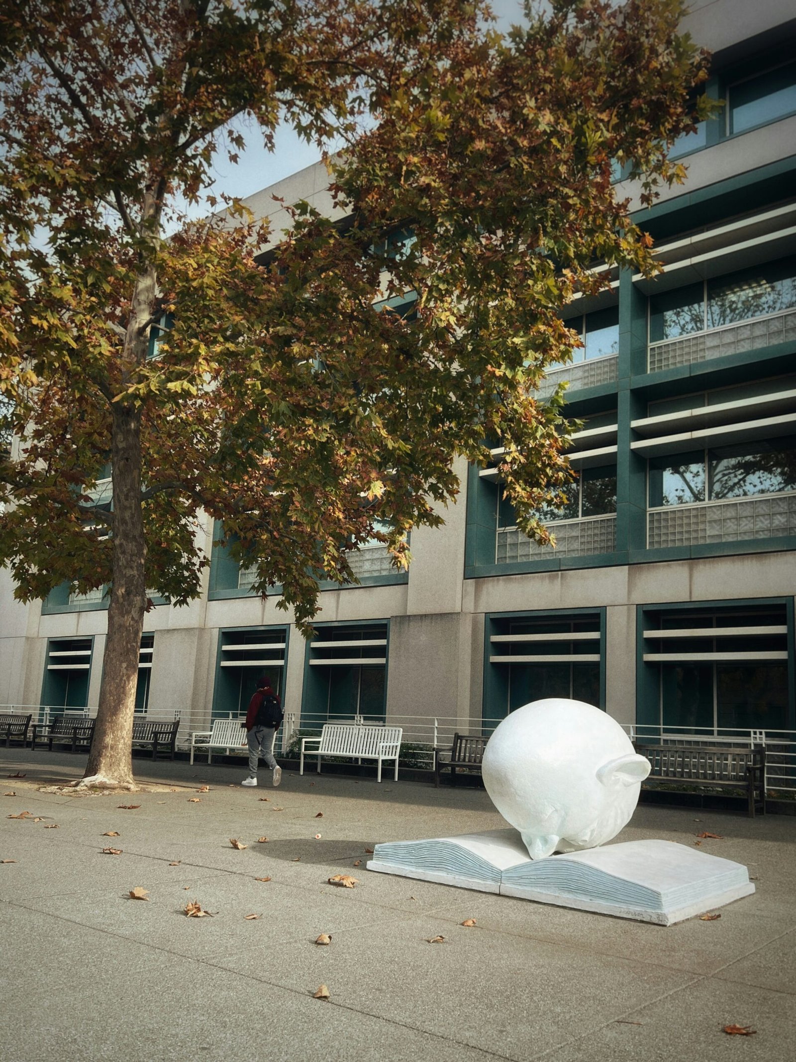 A large white object sitting in front of a building