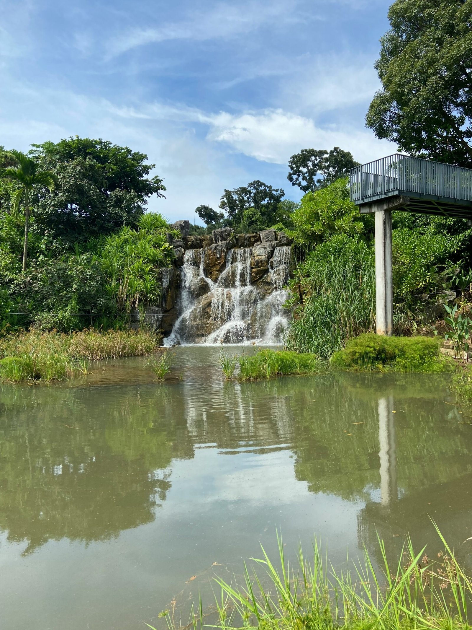 a waterfall in a pond