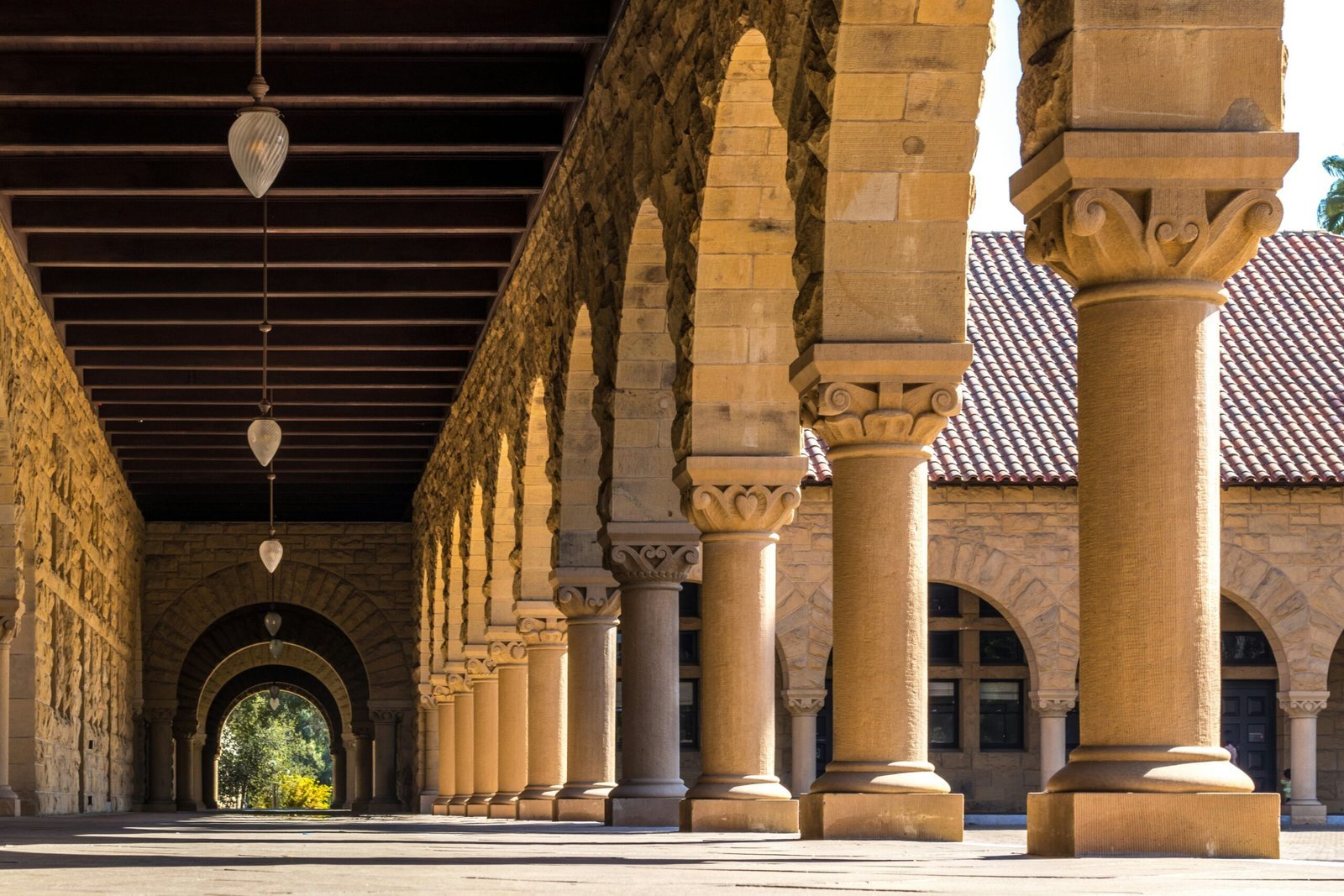 brown concrete hallways with columns